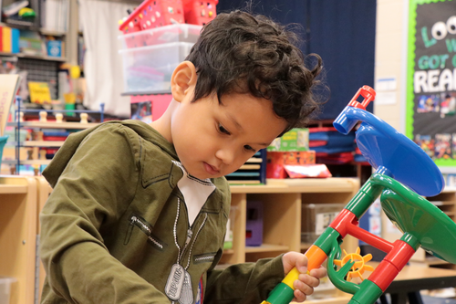 A child plays with blocks